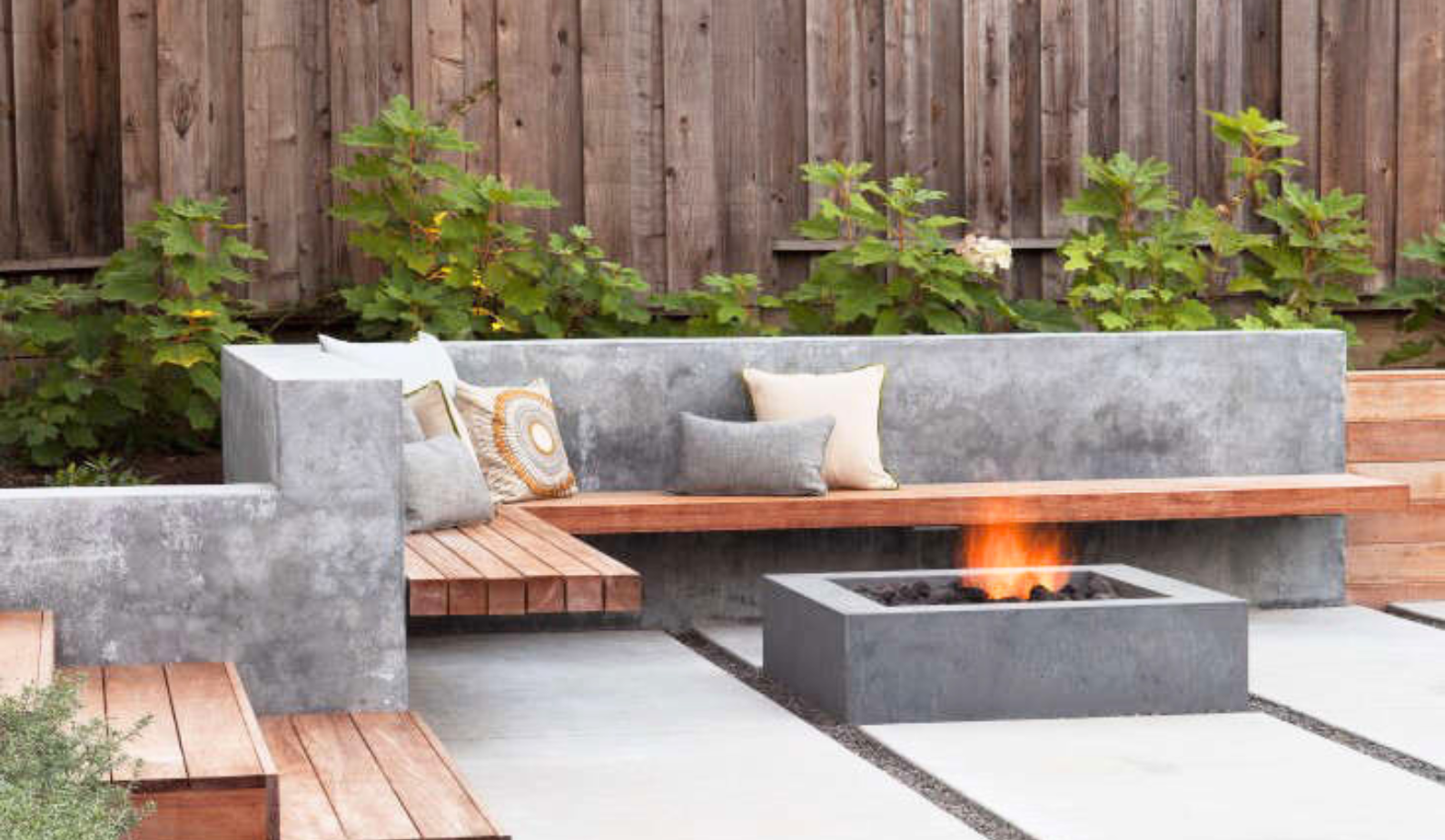 outdoor design with plants firepit and patio